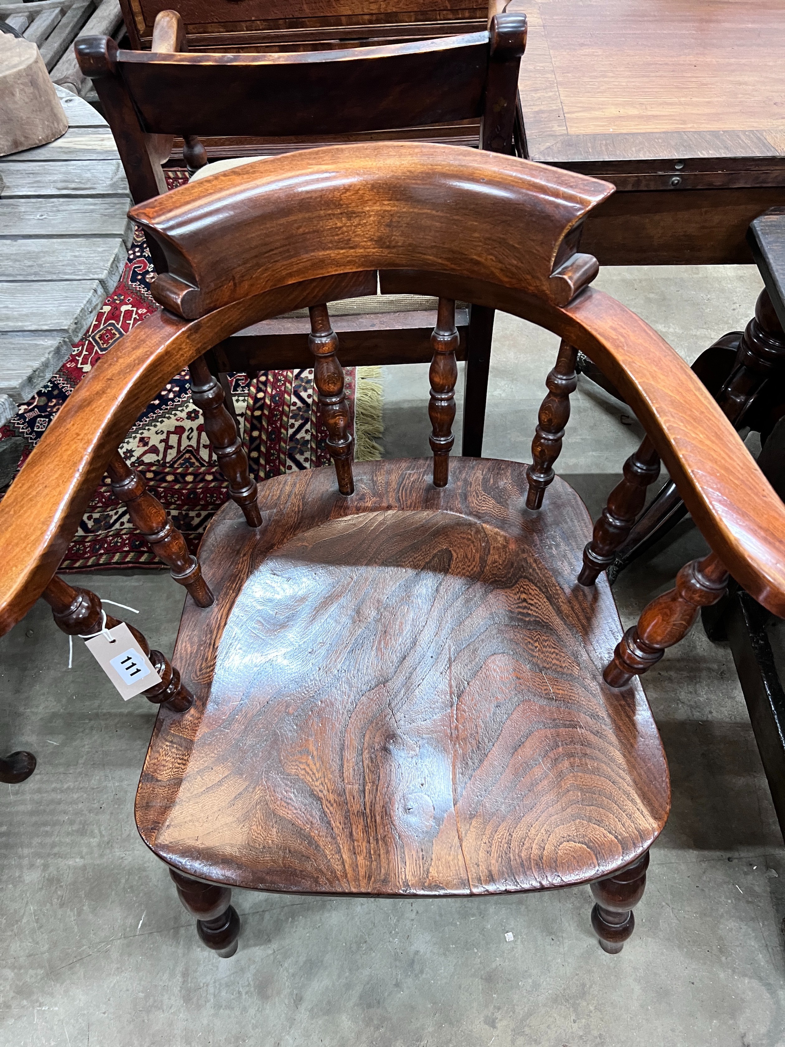 A Victorian style elm and beech smoker's bow chair, width 69cm, depth 50cm, height 82cm *Please note the sale commences at 9am.